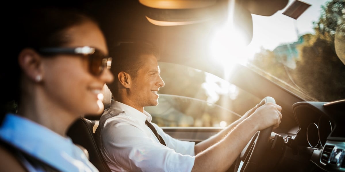 two people travelling by car