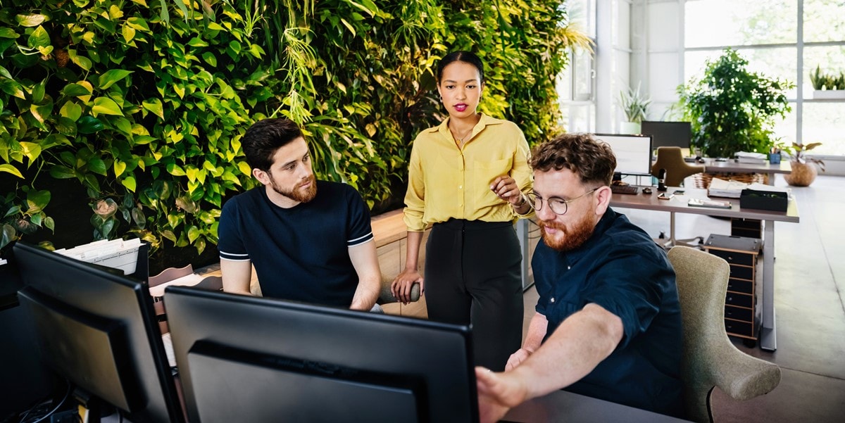 group of professional meeting, next to desks