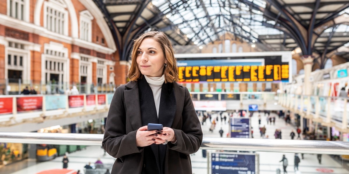 woman standing in train station