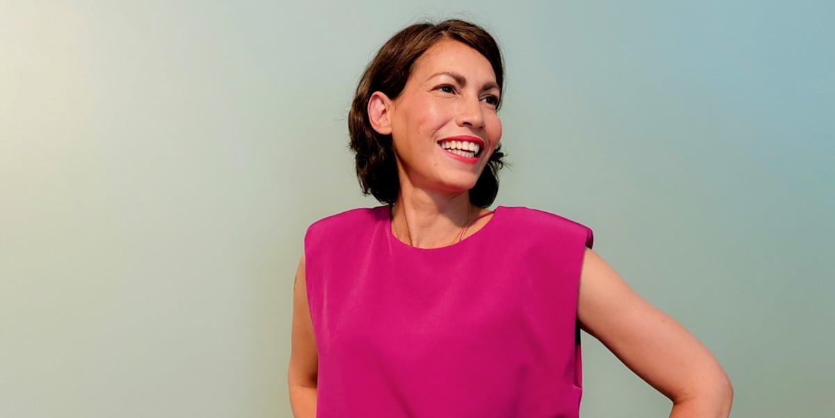 smiling woman wearing hot pink top